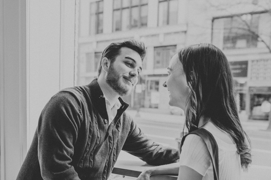 A romantic moment passed during engagement photos at Passenger Coffee in Downtown Lancaster, PA