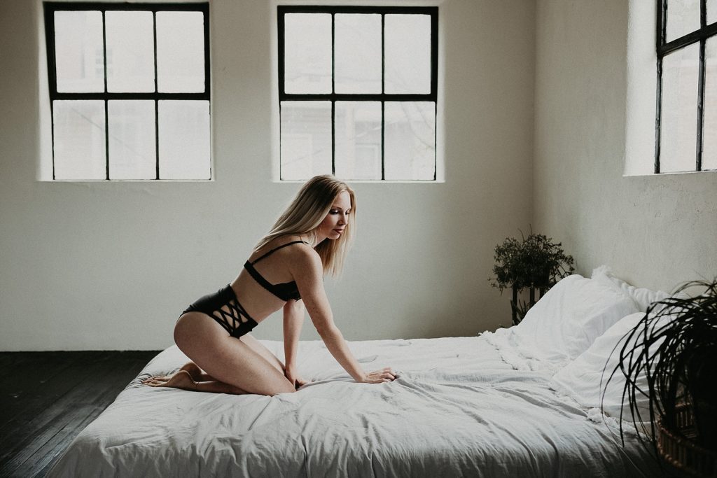 Body curve enhancing boudoir pose during boudoir session in downtown York studio