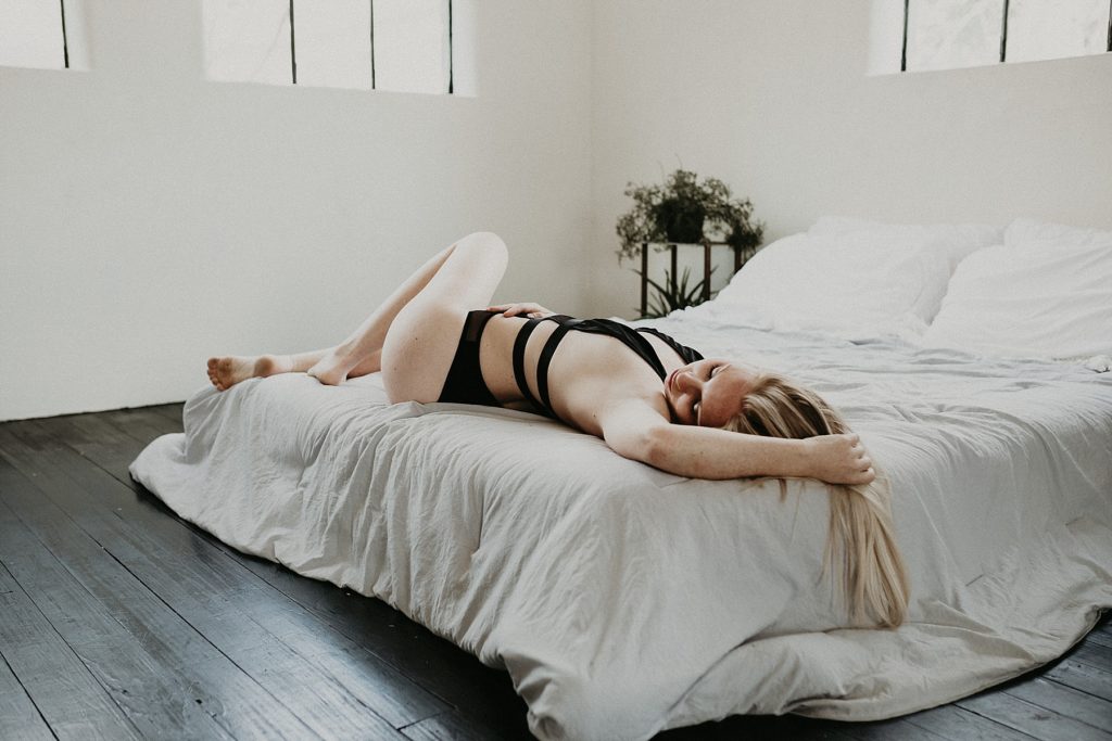 Sexually teasing and tantalizing body suit worn during female boudoir shoot in Downtown York, PA