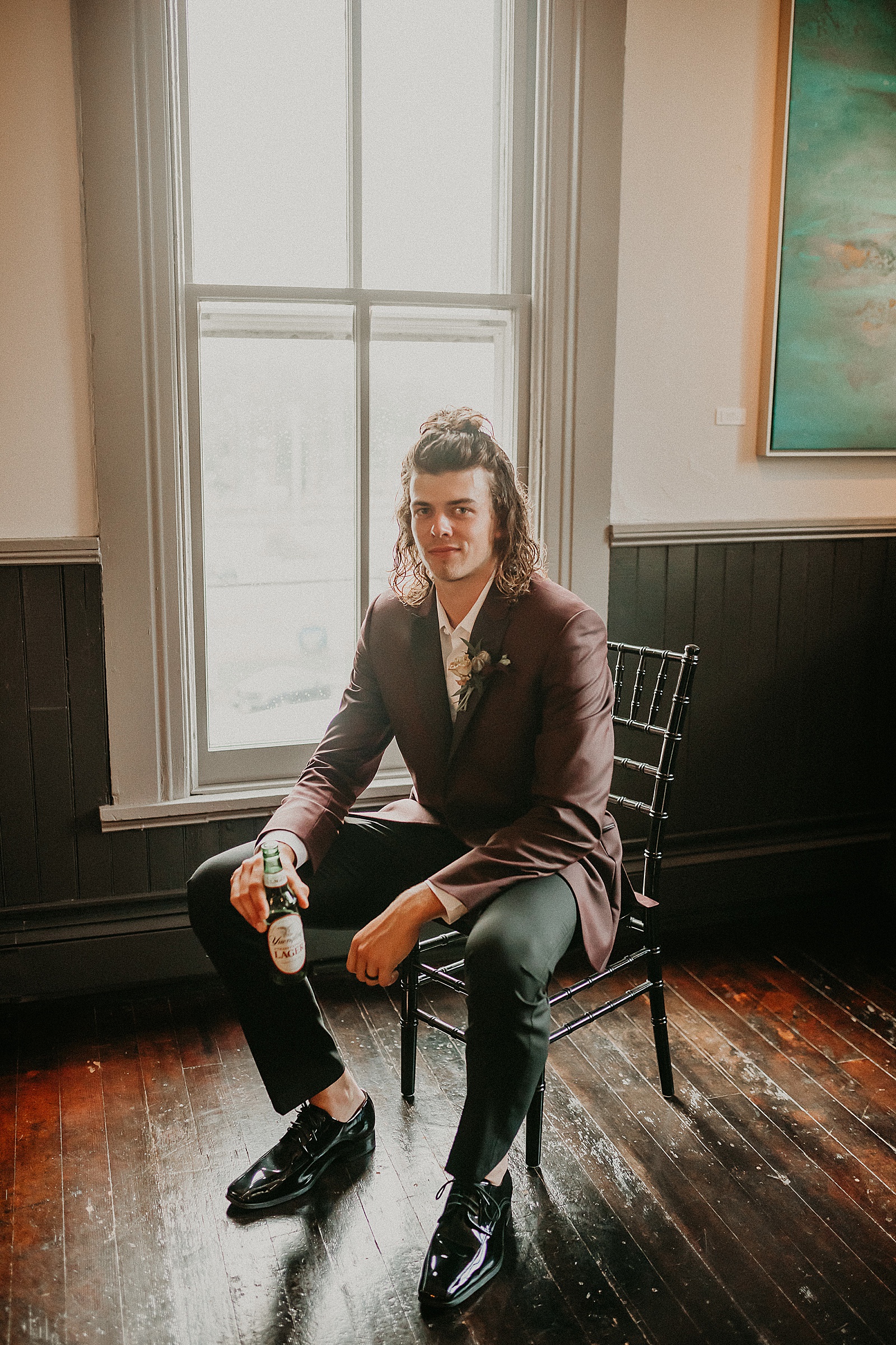 Groom sitting back and relaxing with a Yuengling beer