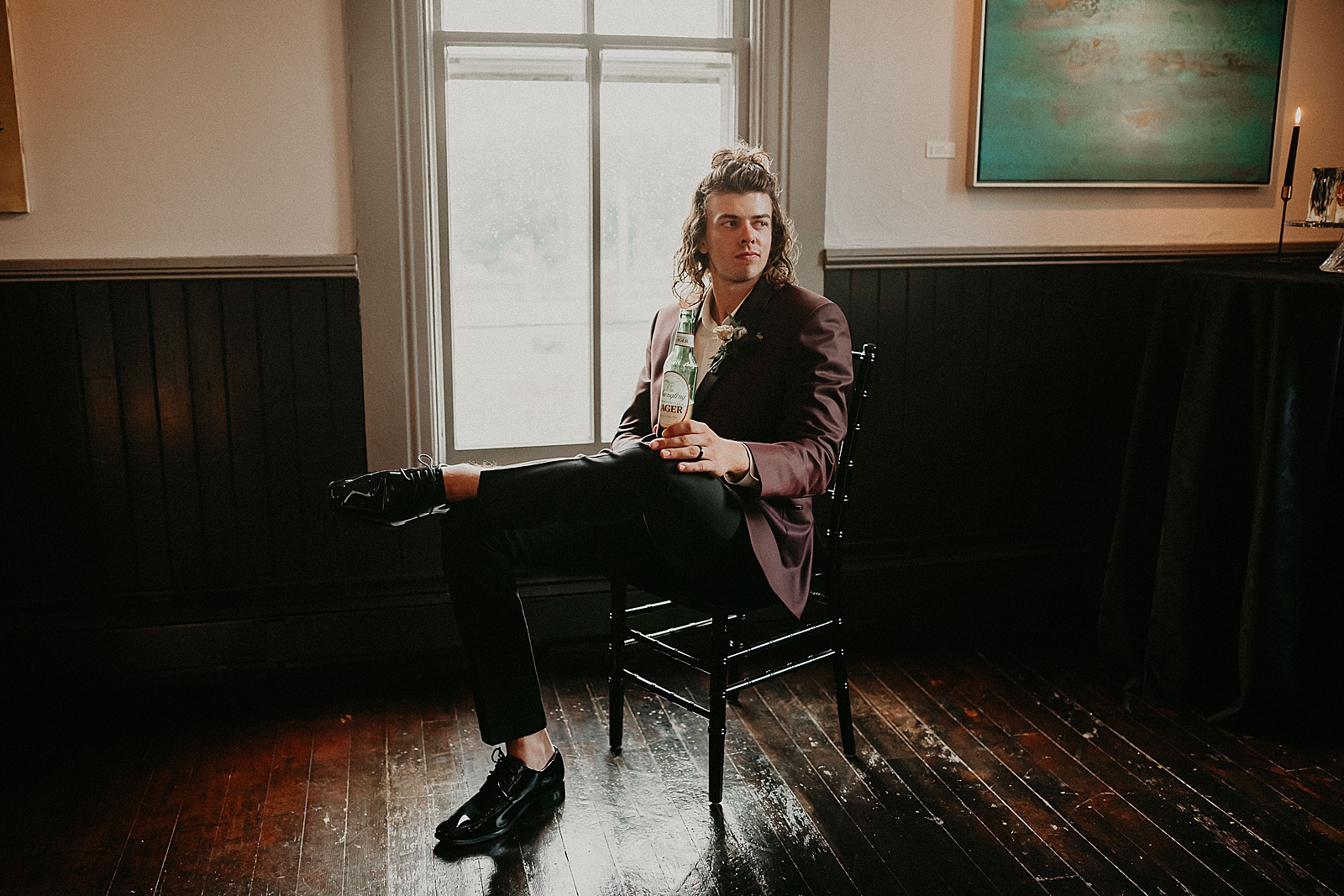 Groom sitting back and relaxing with a Yuengling beer