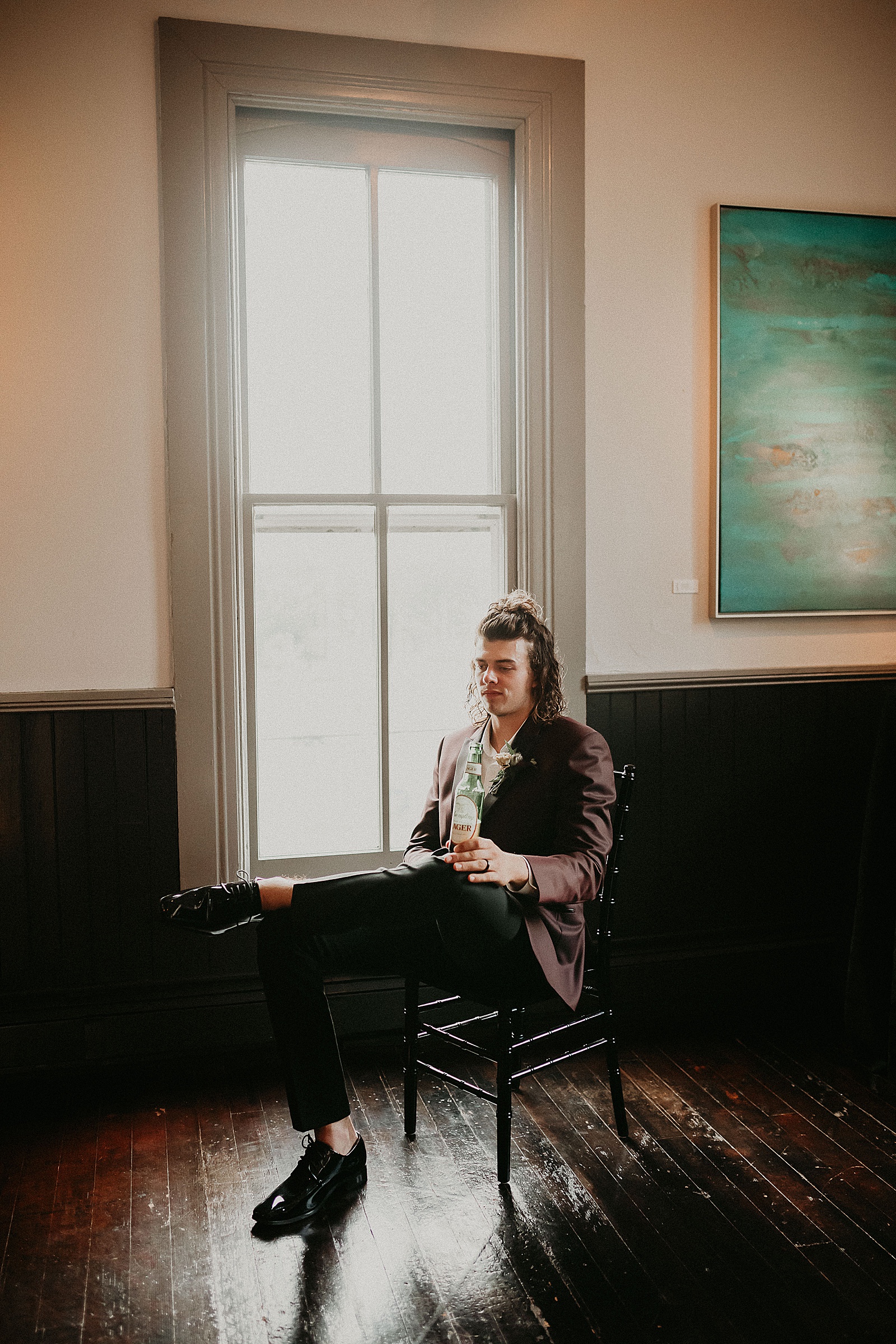 Groom sitting back and relaxing with a Yuengling beer