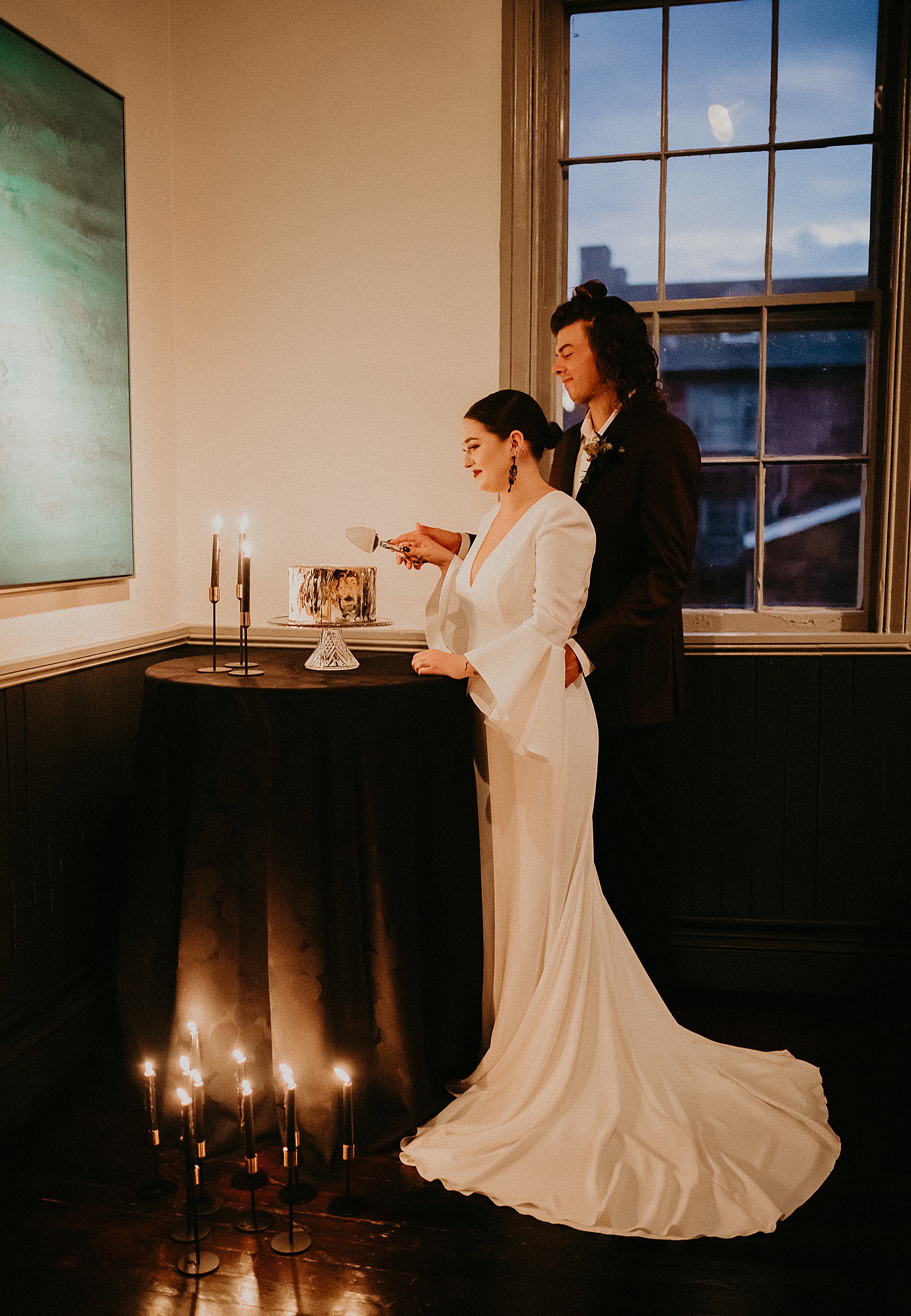 Bride and Groom cutting their wedding cake